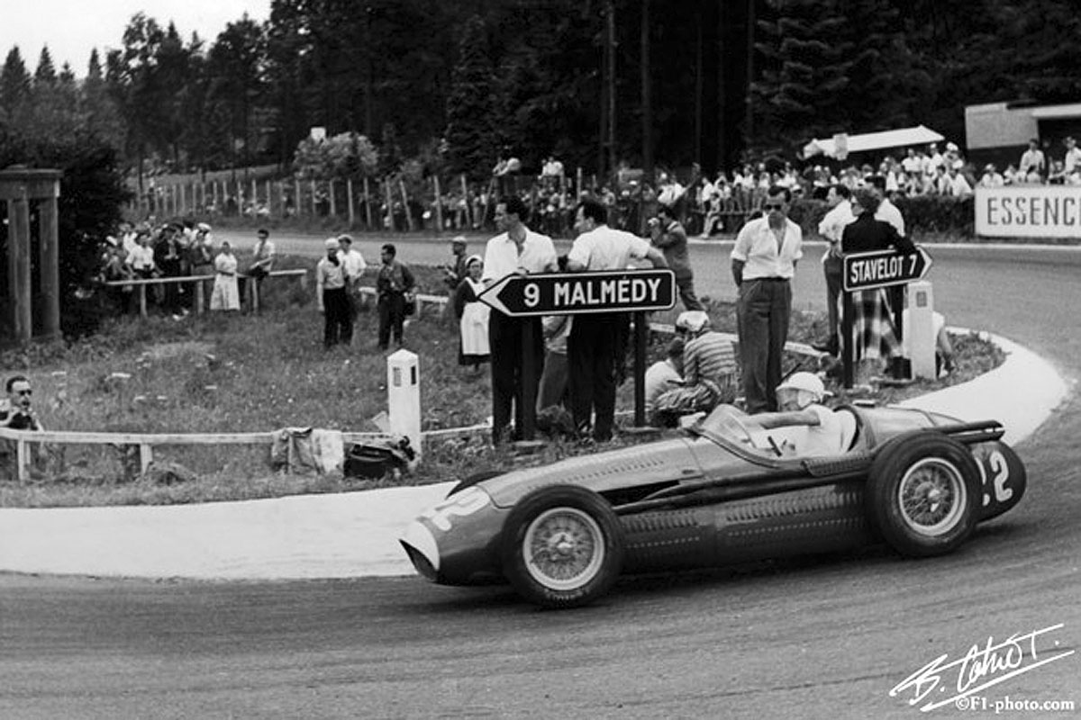 Stirling Moss racing in the 1954 Belgian Grand Prix at Circuit de Spa-Francorchamps.