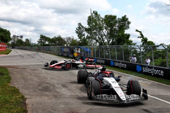 Nyck de Vries (NLD) AlphaTauri AT04 and Kevin Magnussen (DEN) Haas VF-23 run on at the exit road and reverse back on to the circuit.
18.06.2023. Formula 1 World Championship, Rd 9, Canadian Grand Prix, Montreal, Canada, Race Day.
 - www.xpbimages.com, EMail: requests@xpbimages.com © Copyright: Coates / XPB Images